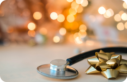 Stethoscope against the background of twinkling gold garlands. Health concept for New Year and Christmas. Copy space.