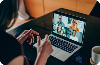 Shot of young woman talking to her friends in video call from home. Multi-ethnic group of people using laptop for a online meeting in video call. Friends having online conversation during quarantine.