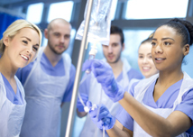 Teamwork, healthcare and medicine with a doctor, nurse and team working together on a glass board in the hospital. Planning, strategy and research in the development and innovation of medical care