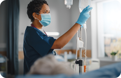 Hospital Ward: Professional Black Head Nurse Wearing Face Mask Does Checkup of Patient's Vitals, Checking Heart Rate Computer, Intravenous or Iv Fluids Drip Bag. Caring Nurse Monitors Person Recovery