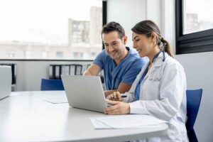 Group of doctors searching for healthcare IT solutions and services