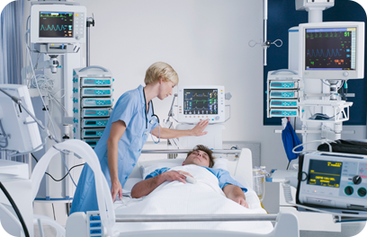 Nurse tending patient in intensive care