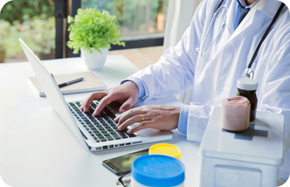 Doctor filling in the patient's information on the laptop