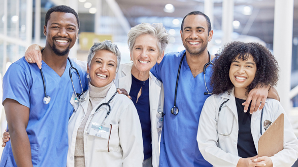 Happy portrait, group and doctors for healthcare service, leadership and teamwork in hospital diversity. Professional medical woman, mentor and internship nurses in clinic management, hug and support