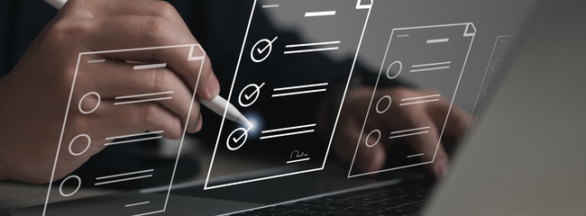 Performance checklist concept : businessman using stylus pen with laptop for questionnaire