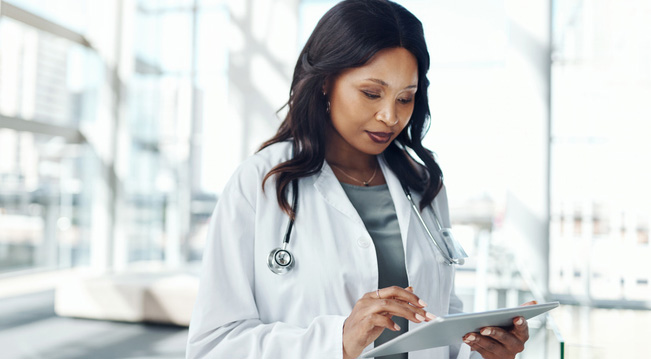 Cropped shot of a medical practitioner using a digital tablet in a hospital